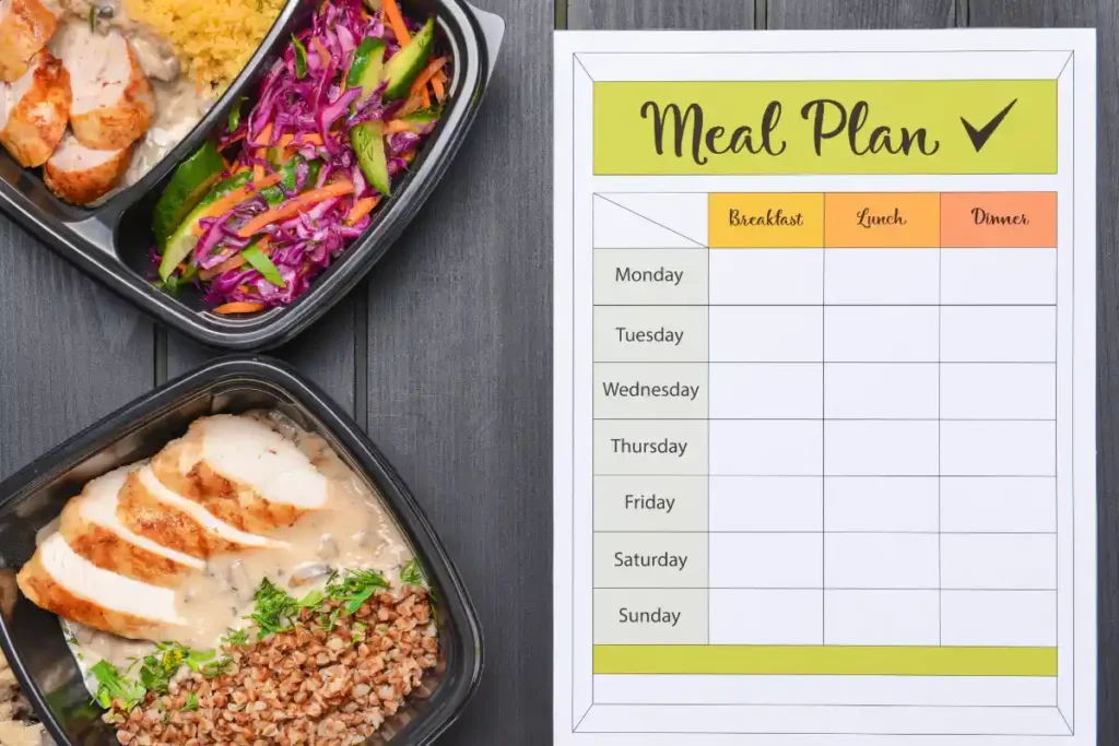 Meal prep containers filled with healthy food, such as grains, vegetables, and protein, organized for a weekly meal plan.