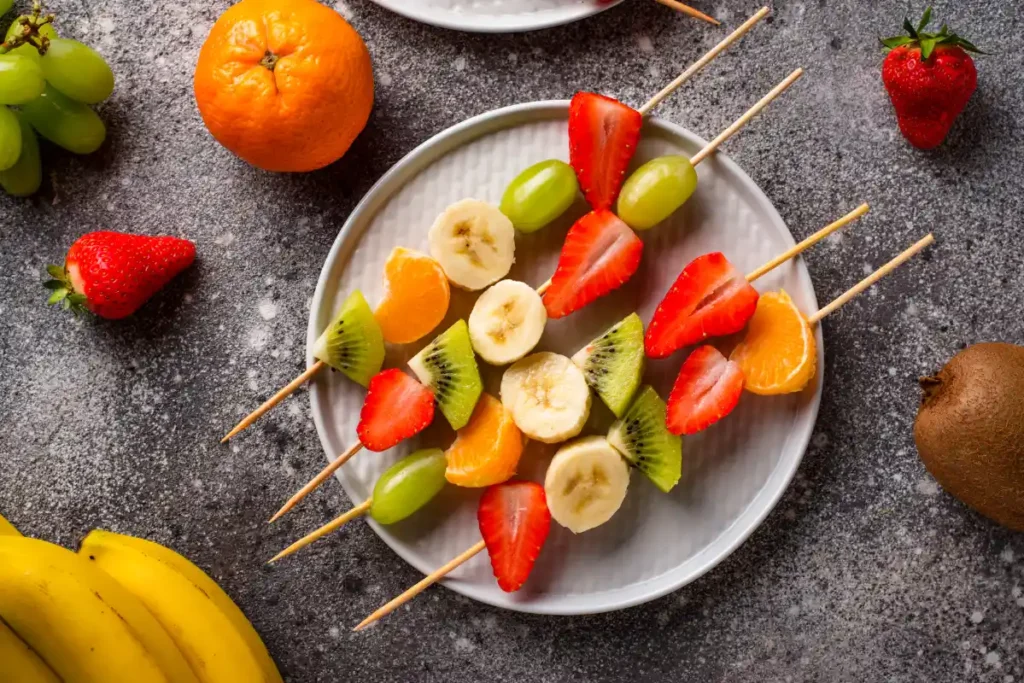 Colorful fruit skewers made with fresh fruits, offering a refreshing and healthy summer snack option.