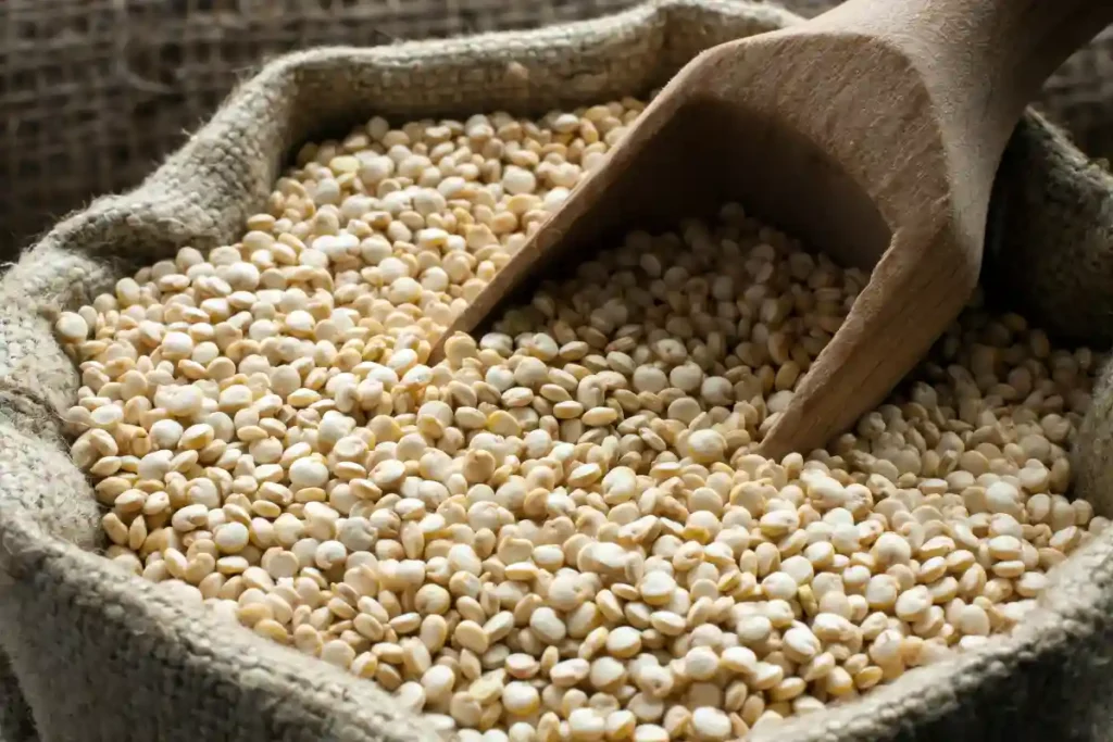 Quinoa grains stored in a burlap sack, highlighting the natural and eco-friendly packaging.