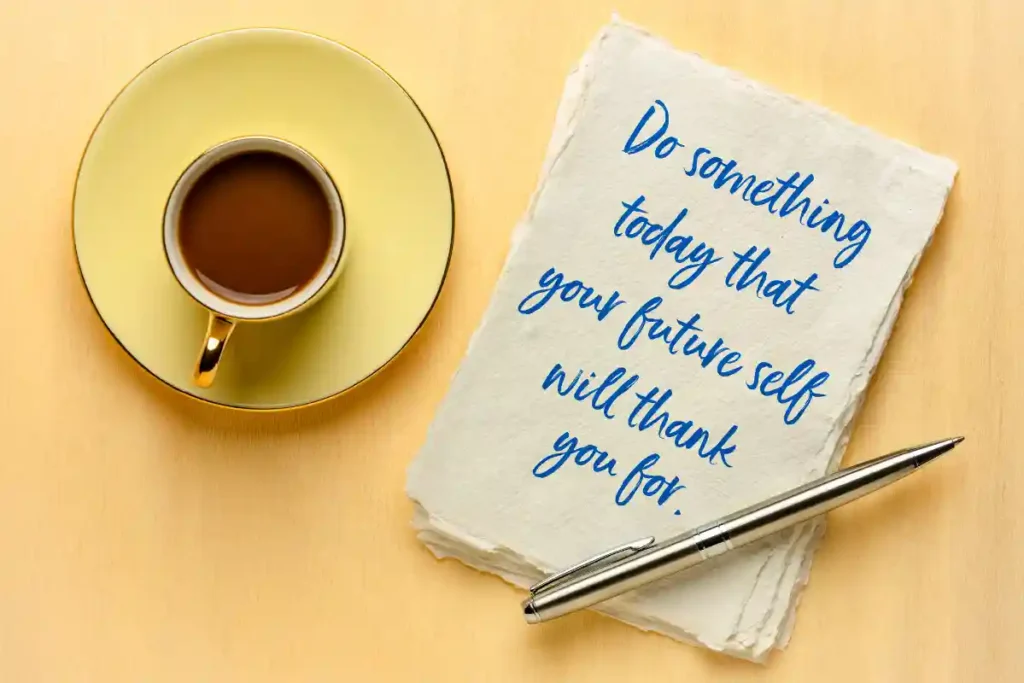 Coffee cup on a table with a napkin featuring the text 'Do something today that your future self will thank you for.'