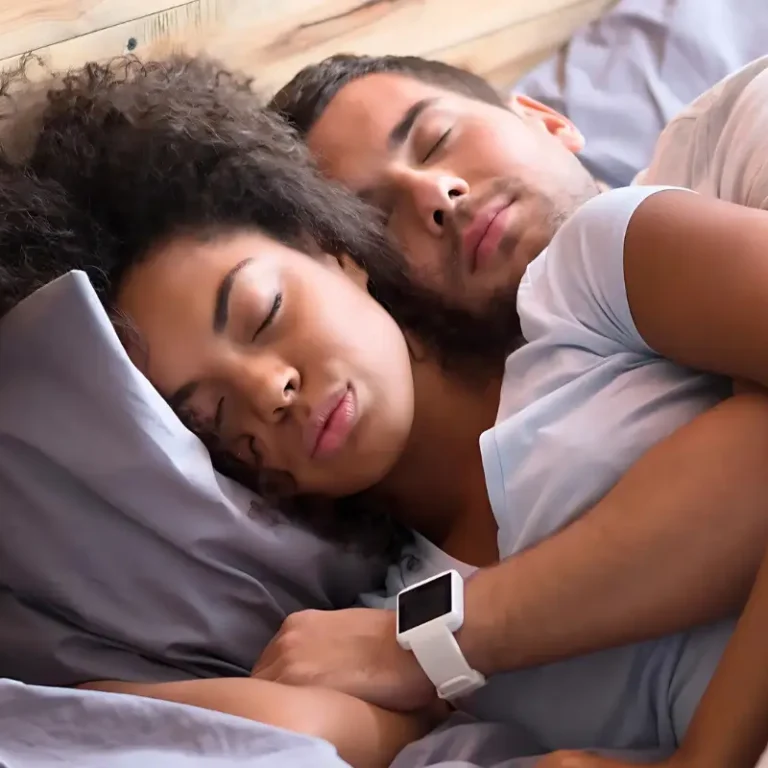 Couple peacefully sleeping at night, enjoying restful sleep.