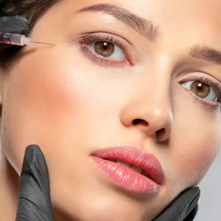 Woman undergoing a botox injection near her eyes for wrinkle reduction.