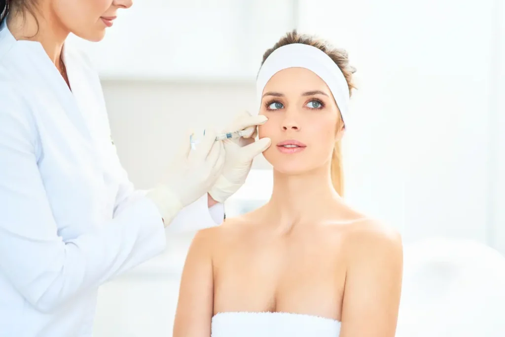 Woman receiving Botox injection treatment in a professional consultation room for cosmetic purposes.